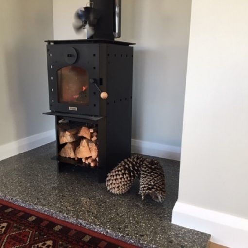 polished concrete fire hearth and log burner photo